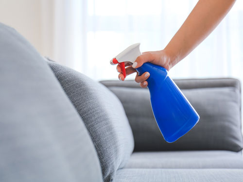 Upholstery being protected by an anti-stain spray
